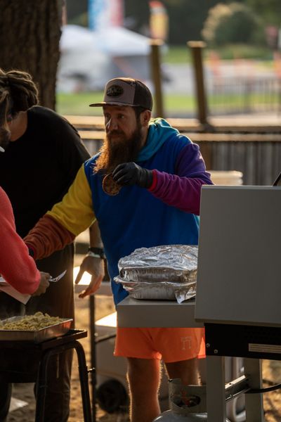 A volunteer at a food service table
