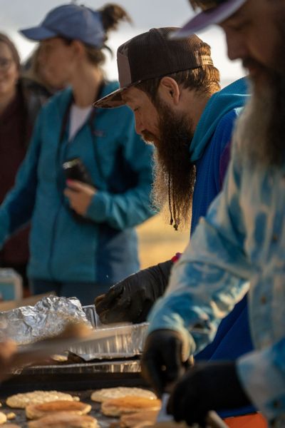 Volunteers preparing and serving food