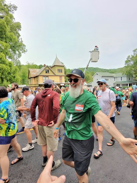 A hiker at an outdoor gathering