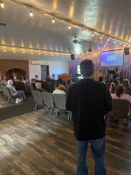 A speaker addressing a gathering indoors